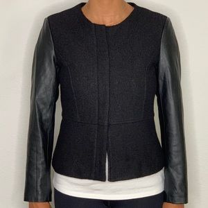 Black collarless jacket.